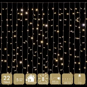 CORTINA 110 LEDS CÁLIDO 4 X 0,50 M 'FUNCIONA CON LA RED ELÉCTRICA 20mA 3.6W. TRANSFORMADOR CON 8 FUNCIONES. IP44 (USO INTERIOR / EXTERIOR) CABLE TRANSPARARENTE DISTANCIA ENTRE BOMBILLAS: 10 CM. 22 TIRAS. DISTANCIA ENTRE TIRAS: 18